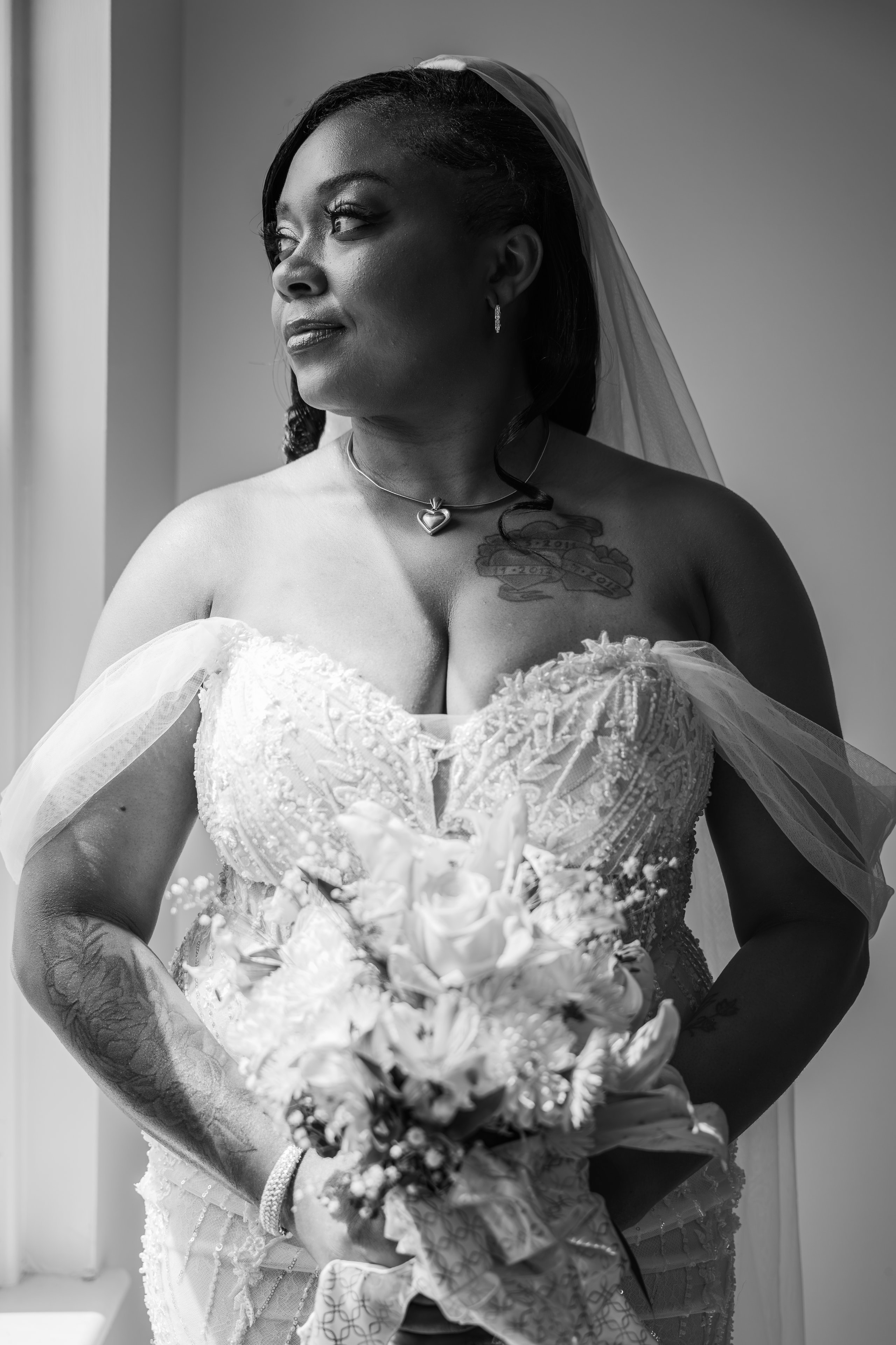 Black and white bridal portrait with bouquet